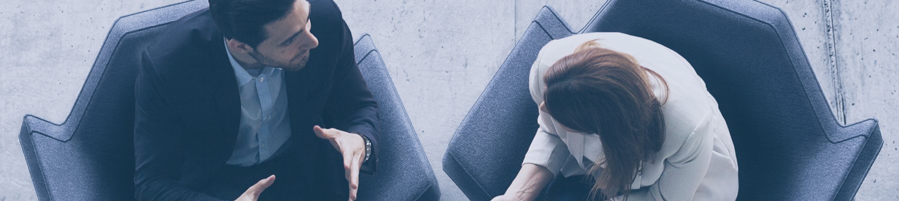 Man and woman sitting in a meeting